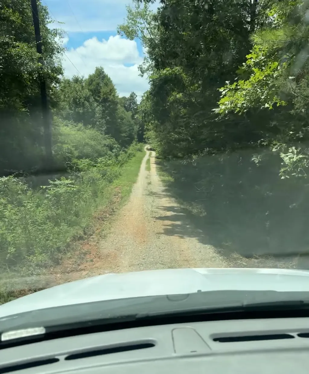 A red-clay track on a rural call. Plenty of Alabama addresses end where the pavement does.