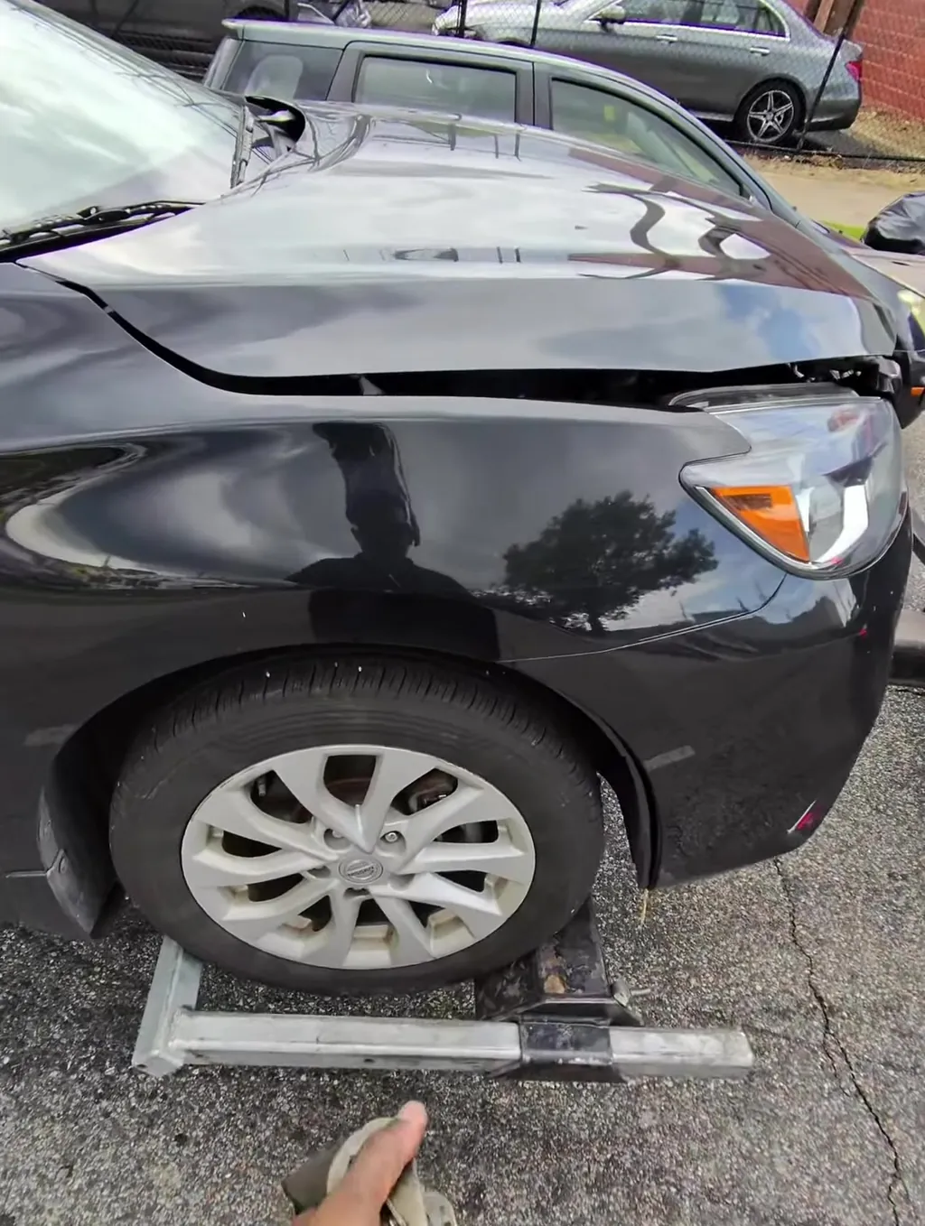 Sedan seated on the deck, straps run, ready to roll.