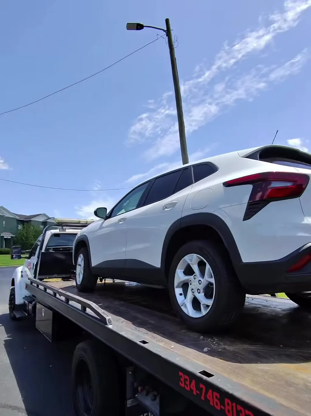 A crossover loaded and squared up on the deck before leaving the lot.