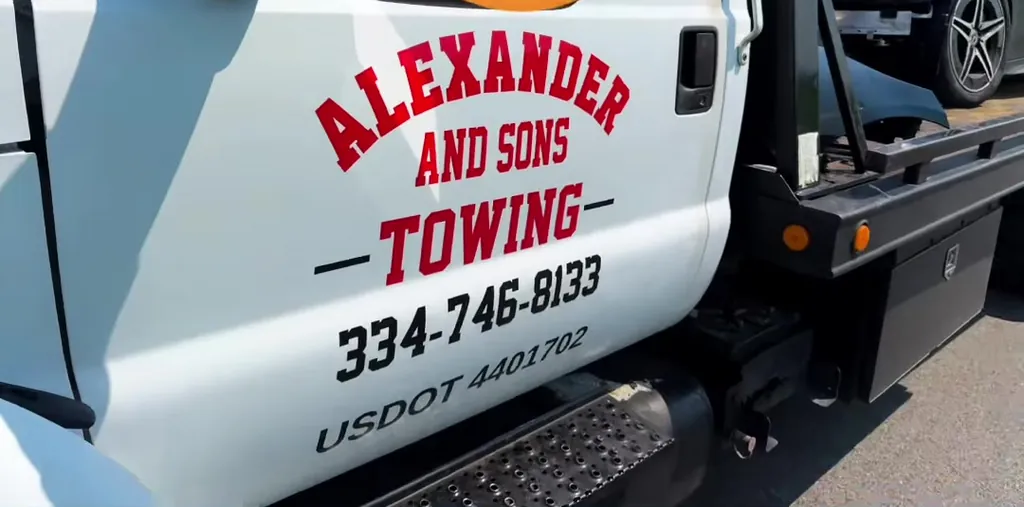 The Alexander and Sons Towing door lettering with phone number and USDOT 4401702